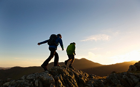 Men hiking on rocky mountainside