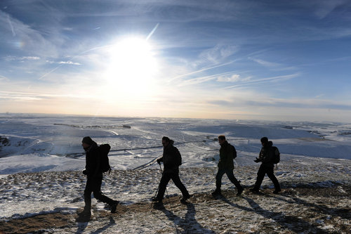 Ramblers enjoy a New Year's Eve walk on the Derbyshire Hills near Mamtor, as the cold weather continues.