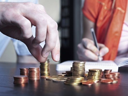 Young couple counting money