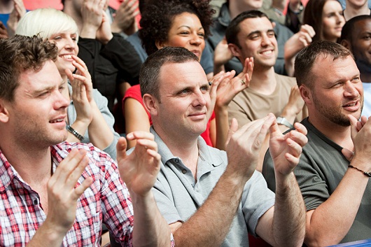 Football fans clapping