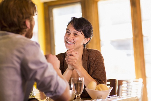 Caucasian couple talking in restaurant